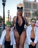 Mother taking children to Halloween party at school