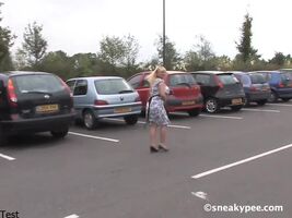 Desperate blonde pees in the parking lot