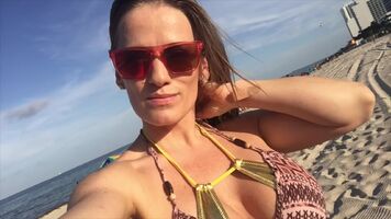Jillian Goes To The Beach In A Tiny Gold Bikini cut