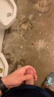 Jerking his cock in the toilets