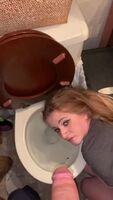 Stupid whore gets pissed on her face with her in the toilet